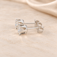 Alternate side view of 1 CTW moissanite stud earrings showing open six-prong S925 sterling silver basket settings.