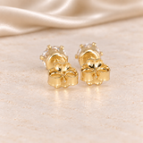 Back view of 1 CTW moissanite stud earrings showing 14/20 gold-filled posts, six-prong settings and butterfly backs.