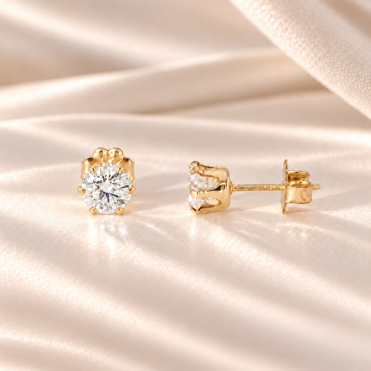 Front and side views of 1 CTW moissanite stud earrings showing six-prong 14/20 gold-filled basket settings and posts.