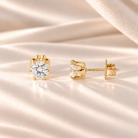 Front and side views of 1 CTW moissanite stud earrings showing six-prong 14/20 gold-filled basket settings and posts.