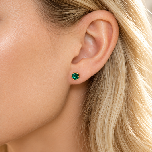 5mm round Zambian-color lab emerald stud earring worn on ear in a six-prong 14/20 gold-filled setting.