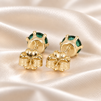 Back view of 5mm lab emerald stud earrings showing six-prong gold-filled settings, posts and butterfly backs.