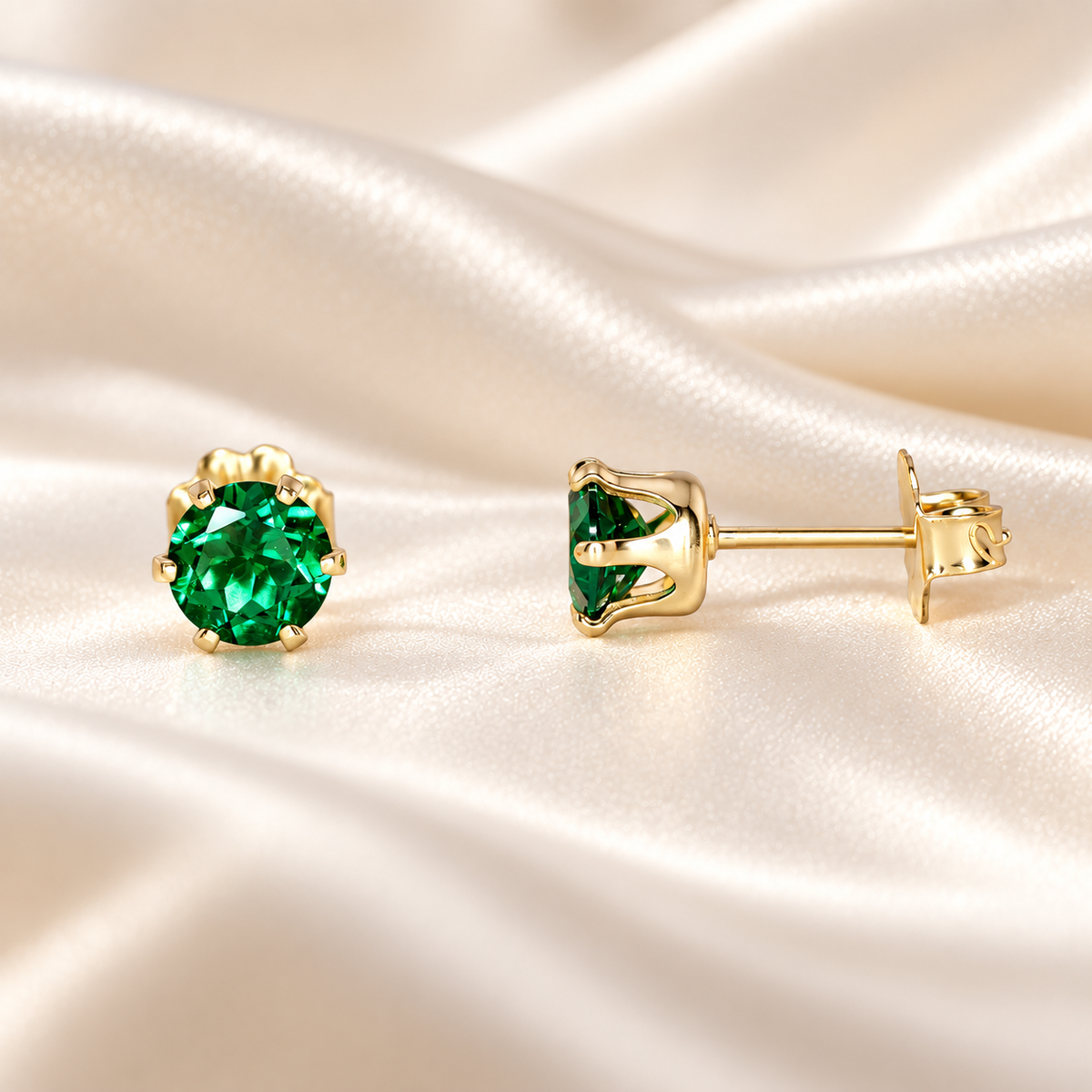 Front and side views of 5mm round lab emerald stud earrings showing the six-prong 14/20 gold-filled basket setting and post.