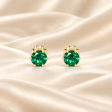 Front view of two 5mm round Zambian-color lab emerald stud earrings in six-prong 14/20 gold-filled settings.