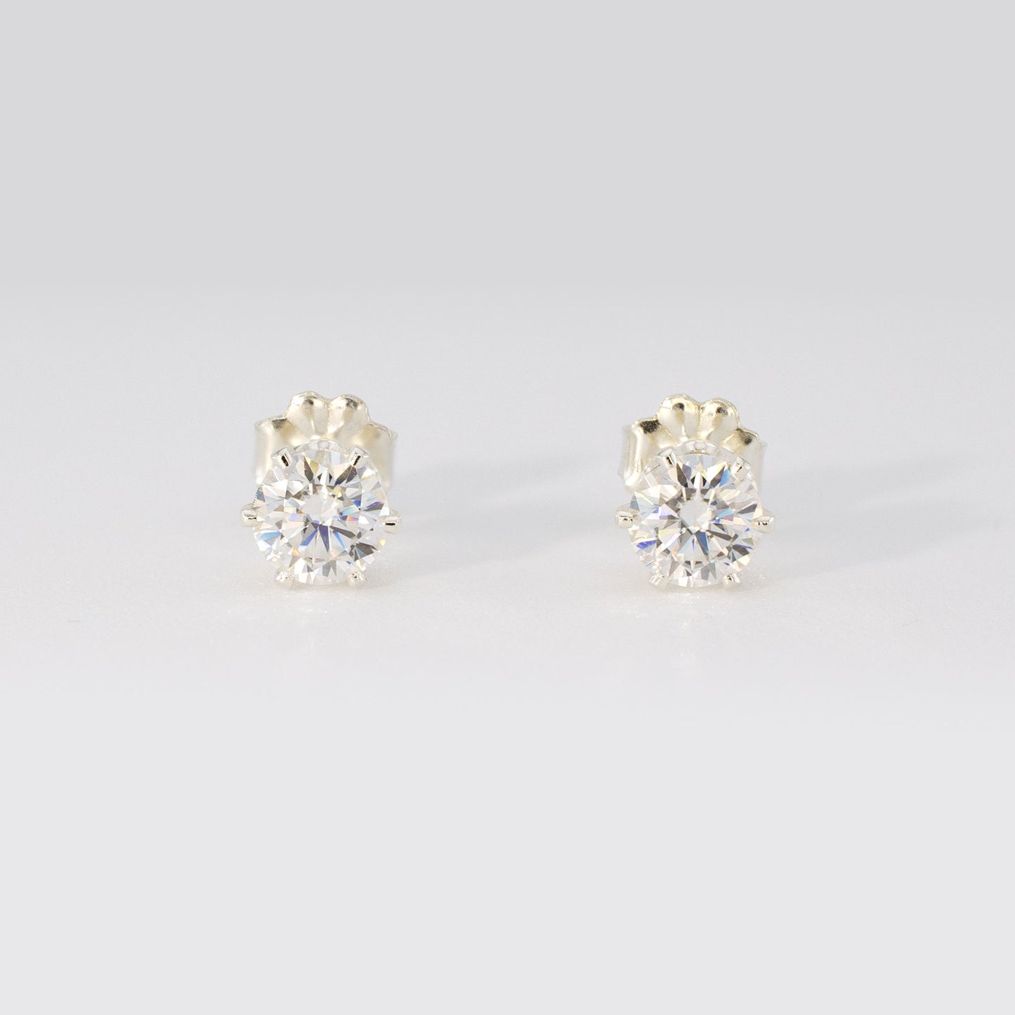 1.00 CTW (0.50ct Each) Round Moissanite Stud Earrings • Solid 925 Sterling Silver